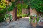 Italy-Tuscany Courtyard of an agriturismo near the hill town of Montalcino Art Print